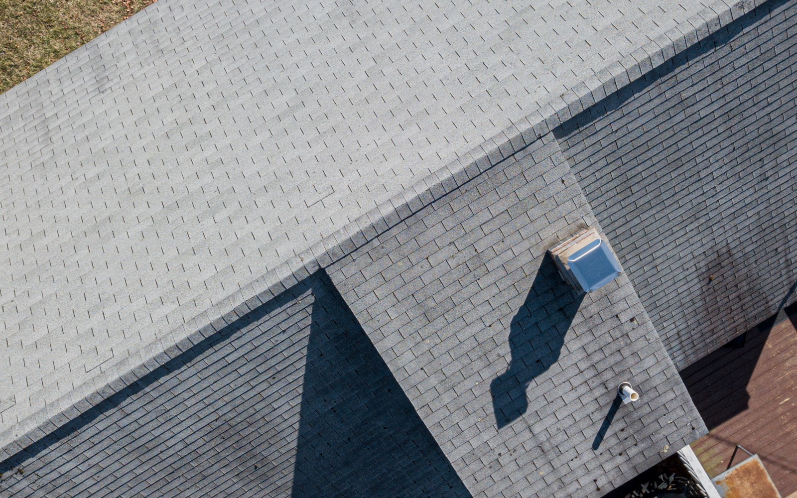 Before: aging shingles with damage
